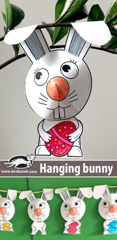 an image of a paper bunny hanging from a tree