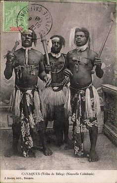 an old photo of three men in native garb