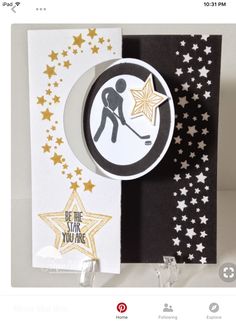 a close up of a card with stars and a person holding a star on it