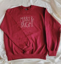 Merry and Bright Crewneck Sweatshirt | Christmas Crewneck Sweatshirt | Holiday Crewneck Sweatshirt Perfect for the Christmas/Winter Season *SWEATSHIRT INFORMATION* -Sizes are unisex. -If you prefer a larger fix, I recommend sizing up 1 size. -We offer sizes S-3XL. If you need a larger size, please message us and we may be able to special order. *CARE INFORMATION* -Please wash inside out on gentle settings and air dry for long lasting wear. -Do not dry clean. -Do not iron directly on graphic. Sweatshirt Cricut Ideas, Holiday Crewneck, Christmas Crewneck Sweatshirt, Halloween Tee Shirts, Christmas Crewneck, Vinyl Shirts, Sweatshirt Christmas, Halloween Tees, Custom Tees