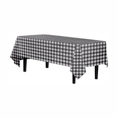 a black and white checkered tablecloth on top of a wooden table with two legs