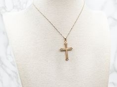 This exquisite yellow gold cross pendant is finely textured for a luxurious look. Crafted with intricate detail, it makes an elegant statement of your faith. Perfect for formal or casual wear.This pendant does not come with the chain shown. Please feel free to contact us, we will help you find the perfect chain for your style and budget!Metal: 14K Yellow GoldMeasurements: 23 x 40 mm, with bail 14k Gold Diamond Cut Cross Necklace, Elegant Cross Necklace For Formal Occasions, Luxury Crucifix Cross Necklace For Formal Occasions, Elegant Formal Cross Necklace, Gold Cross Necklace With Figaro Chain, Yellow Gold Filigree Cross Pendant Necklace, Yellow Gold Cross Jewelry With Figaro Chain, 14k Gold Cross Figaro Chain Jewelry, Luxury Diamond Cut Cross Pendant Necklace