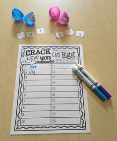 a table topped with lots of different items on top of it, including markers and pencils