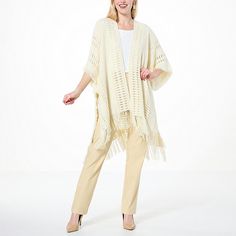 Antthony Fringe Sweater Topper  Made from a soft acrylic sweater knit yarn, Antthony's stunning ruana wrap provides seasonless beauty and lightweight warmth for day or evening. The open crochet detail gives it a unique boho style that complements everything from jeans to dress pants to dresses. Elegant Spring Acrylic Sweater, Spring Beige Knit Poncho, Beige Knit Poncho For Spring, Chic Knit Poncho For Spring, Spring Beige Acrylic Cardigan, Spring Wrap Sweater In Soft Knit, One Size Knit Shawl Cardigan, One Size Knit Shawl Outerwear, Spring Acrylic Yarn Knitted Cardigan