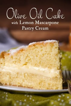 a slice of cake with lemon mascarpone on a plate next to a fork