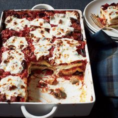 a casserole dish with meat and cheese on the side, ready to be eaten