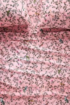 pink floral fabric with green leaves and birds