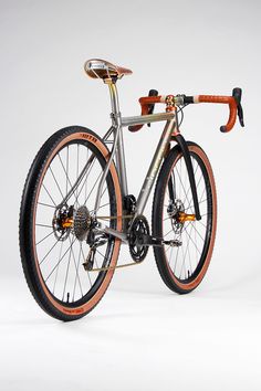 a bike with orange rims is shown against a white background