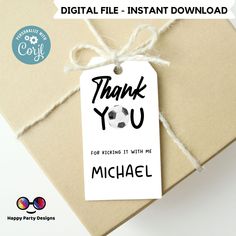 a thank you tag with a soccer ball on it is tied to a gift box