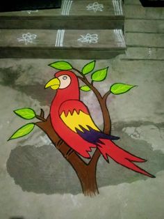 a red bird sitting on top of a tree branch next to some steps and stairs