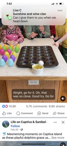 two people are sitting at a kitchen counter with an egg tray on it and one person is