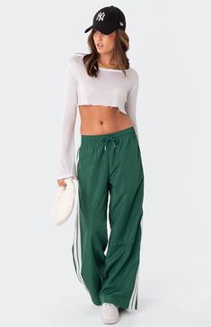 These track pants offer both style and comfort, making them perfect for a sporty yet fashionable look. They're ideal for any activity, ensuring you feel comfortable and confident throughout your entire day.Track pantsSide stripe detailDrawstring waistbandNylon fabricPolyesterModel wears size SModel height is 5'6Item care: Wash with similar color Edikted Womens Fauna Track Pants - Green size Small Nylon Track Pants, Track Pants Outfit, Visionary Fashion, Track Pants Women, Side Stripe, Sport Pants, Pants Outfit, S Models, Pacsun