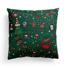 a green pillow with christmas decorations on it