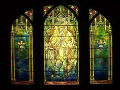 a stained glass window with an angel on it