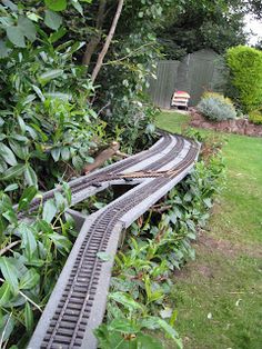 a train track that is laying in the grass