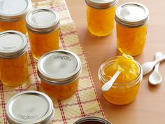 homemade orange marmalade in mason jars on a table