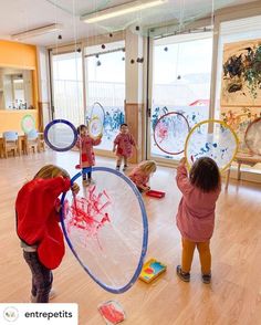 children are playing with their toys in the room