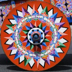 an orange wheel with colorful designs on it