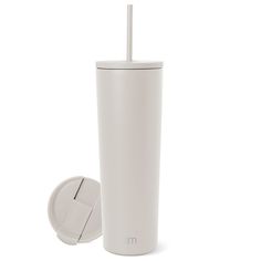 a white tumbler cup with a straw in it and a lid on the side