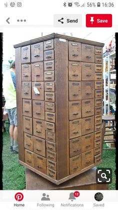 an old wooden filing cabinet with many drawers