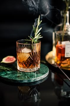 a glass filled with liquid sitting on top of a table