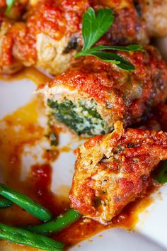 meatballs with sauce and green beans on a plate