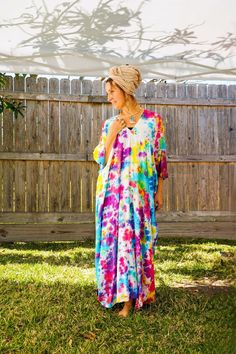 "Add a touch of unique style to your wardrobe with our Hand-Dyed Kaftan Dress! This stunning dress is made from 100% breathable and comfy rayon fabric, ensuring maximum comfort all day long. Using our unique method, each dress is carefully hand dyed, resulting in a one-of-a- kind masterpiece. The intricate patterns and vibrant colors make this dress a true work of art. The kaftan dress comes in a versatile one size fits most (M-3XL), making it extremely comfortable for a wide range of body types. With a bust measurement of up to 60\", you can feel confident that this dress will flatter your figure. The dress measures 55\" in length and 45\" in width, providing a loose and flowing fit that is both stylish and flattering. Featuring a trendy V-neck design and side slits, this slipover style d Bohemian Hand Dyed Maxi Dress For Festivals, Bohemian Tie Dye Beach Dress Cover-up, Free Size Tie Dye Maxi Dress For Beach, Hand Dyed Maxi Dress For Spring Vacation, Multicolor Hippie Maxi Dress For Beach Cover-up, Multicolor Hippie Maxi Dress For Beach, Festival Hand Dyed Maxi Dress, Oversized Bohemian Multicolor Maxi Dress, Hand Dyed Tie Dye Dresses For Vacation