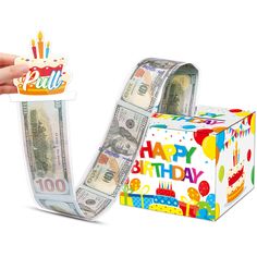 a birthday cake and money in a gift box