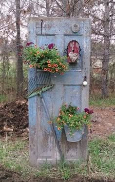 an old outhouse with flowers growing on it