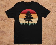 Pine Tree Shirt for Backpackers, Campers and Hikers.  Looking for a perfect gift for hikers, backpackers or camping enthusiasts? Look no further than this unique and stylish retro sunset tree t-shirt. It's the perfect Shirt for Backpacker or tee for hiker that you've been searching for. This Hiker Gift Shirt is sure to be a hit with anyone who loves spending time in the great outdoors. Featuring a minimalist sunset and a happy tree silhouette, this outdoorsy shirt is the ideal addition to any na Outdoorsy Shirt, Camping Hoodie, Hiker Gifts, Hiking Gifts, Happy Tree, Retro Sunset, Tree Shirt, Tree Silhouette, Sunset Colors