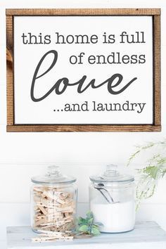 a sign that says this home is full of endless love and laundry