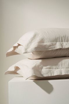 two white pillows stacked on top of each other