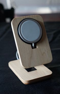 a wooden stand with an electronic device on it