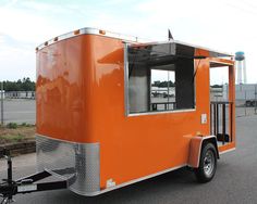 an orange food trailer on a white background