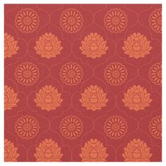 an orange and red flower pattern on a red background, with small circles in the center