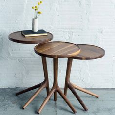 two wooden tables sitting next to each other