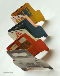 several credit cards are stacked on top of each other in the shape of a car