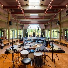 an empty room with drums and other musical equipment