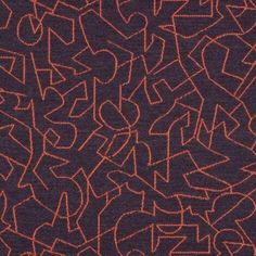 an orange and brown pattern with letters on it