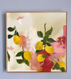 a painting hanging on the wall next to a vase filled with lemons and flowers