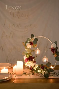 the table is set with candles and flowers