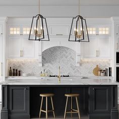 a kitchen with marble counter tops and two stools in front of an island that's surrounded by white cabinets