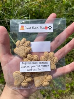 a person holding some dog treats in their hand