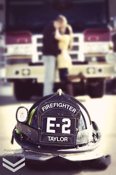 a firefighter hat sitting on top of a table