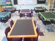 an empty classroom with desks and chairs