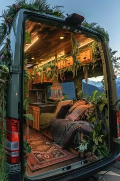 the back end of a van filled with plants and furniture