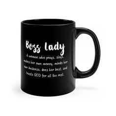 a black coffee mug with the words boss lady written in white on it and an image of a woman who prays