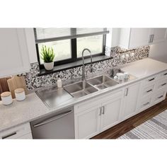 a kitchen with white cabinets and granite counter tops, along with a dishwasher