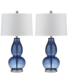 two blue glass table lamps with white shades