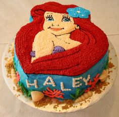 there is a cake that has been made to look like the little mermaid on it